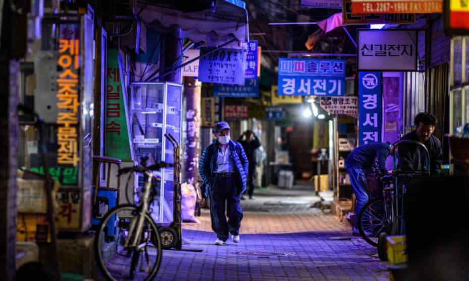 Man walks down a street in South Korea