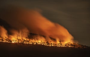 Fire burns along the western ridge of Pilot Mountain in North Carolina.