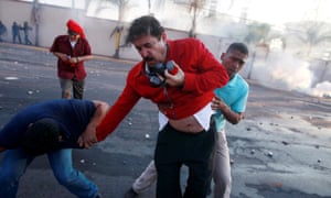 Manuel Zelaya is overcome by tear gas during a protest against the re-election of Honduras President Juan Orlando Hernández in Tegucigalpa January 2018.