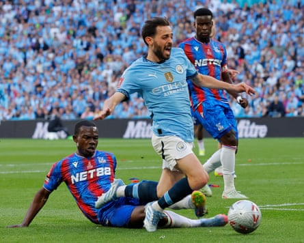 Manchester City’s Bernardo Silva is fouled by Tyrick Mitchell