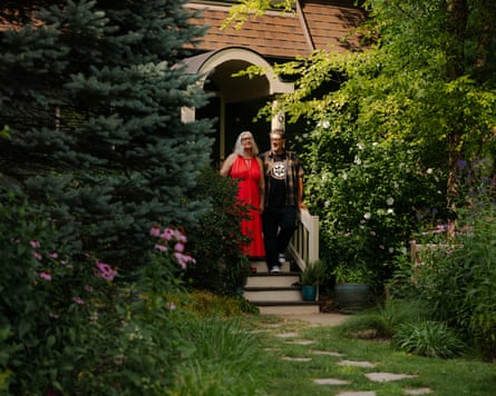 Crystal Fritz and James McGuire’s pose for a portrait in their yard in Highland Park, Illinois, a suburb of Chicago, on July 24th 2026. Despite having no horticulture training, they have transformed their lawn from a monocrop of turf to a thriving native ecosystem in the middle of the suburbs. The abundance of native plants provides food and habitat for a plethora of wild critters: sightings of birds, butterflies, bees, rabbits, bats, and even foxes are now common occurrences in their yard.