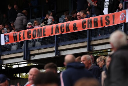 Luton fans display a welcome message to the new manager, Jack Wilshere, and the assistant, Chris Powell, at the start of the match