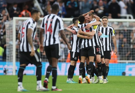 Newcastle United's Dan Burn and Jacob Murphy celebrate after qualifying for the Champions League.