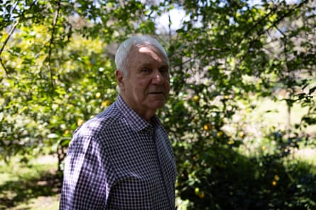 Pearman in the garden in front of a tree