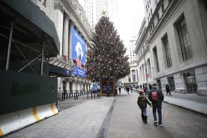 A giant Christmas tree stands at the entrance to the New York Stock Exchange on Wall Street.