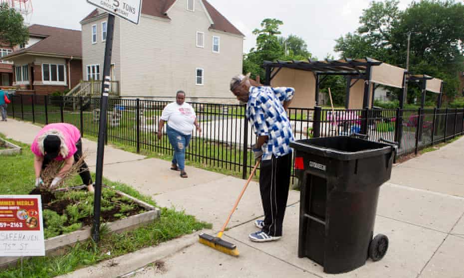 Residents clean up the streets in Englewood, Chicago, where abandoned lots have been turned into urban farms