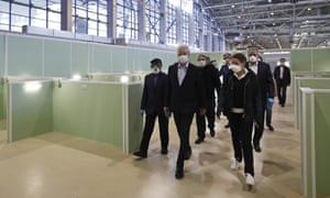 Moscow mayor Sergei Sobyanin (centre) visits a temporary medical facility built for Covid-19 patients at the VDNKh Exhibition Centre.