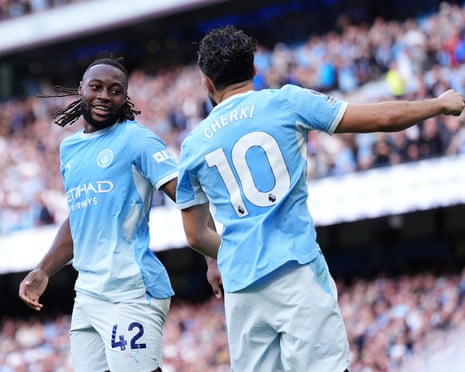 Manchester City's Antoine Semenyo celebrates with teammate Rayan Cherki