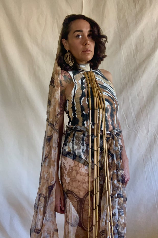 Lillardia Briggs-Houston wears her award winning Walung stone print jumpsuit on hand printed silk velvet devore, with printed veil and seed earrings.