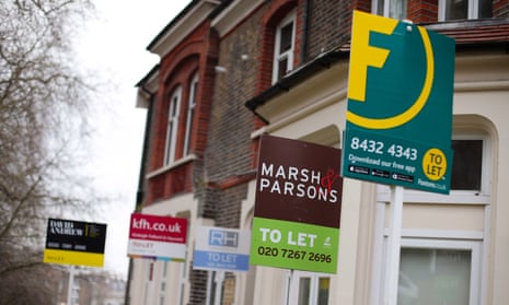 Estate agent signs placed outside houses in north London. 