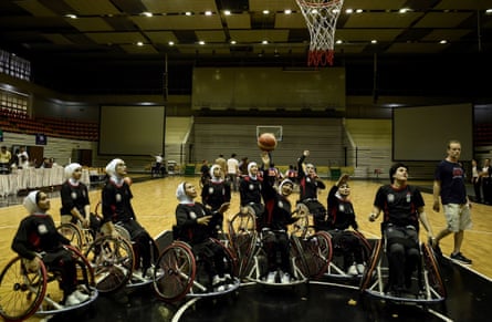 Afghanistan’s women’s wheelchair basketball team warm up on court during the qualifying tournament for the Asia Para Games in Bangkok in 2012.