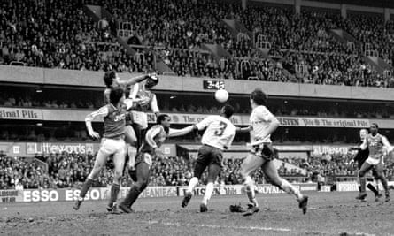 Spurs goalkeeper Ray Clemence clears the ball during the second leg of the League Cup semi-final.