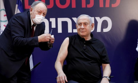 Israel’s prime minister, Benjamin Netanyahu, receiving a Covid-19 vaccine on Saturday.