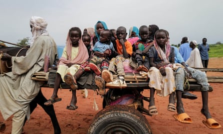 lots of children on a cart in desert region