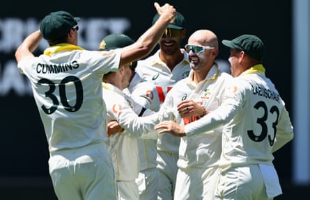 Nathan Lyon celebrates with teammates after dismissing Ben Duckett in the third Test.
