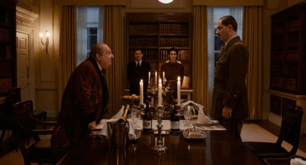Simon Russell Beale in character as Winston Churchill stood opposite De Gaulle at a dinner table