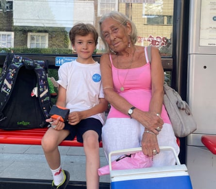 Kimberley Lloyd and grandson Wyatt at a bus stop.