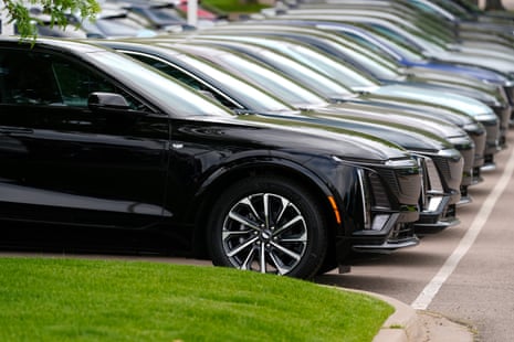New cars sit in a row.