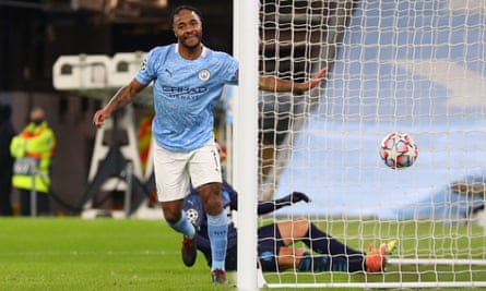 Raheem Sterling celebrates netting a late third goal in a comfortable win for Manchester City.