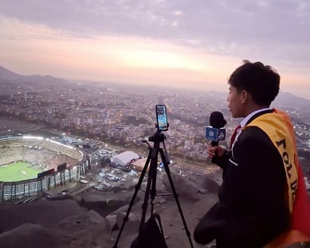 Cliver Huamán, 15, commentates on the Copa Libertadores final from a hillside overlooking the ground in Peru.