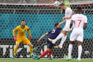 Switzerland’s forward Haris Seferovic heads the ball to score the first goal.