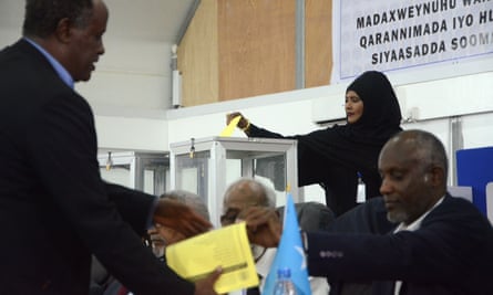 A Somali lawmaker casts her vote to elect a new president.