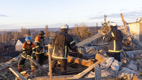 'Plaster was falling on me': Russian drone attack hits Kharkiv – video