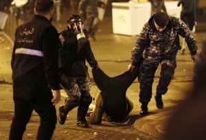 Riot police arrest an anti-government protester in Beirut.