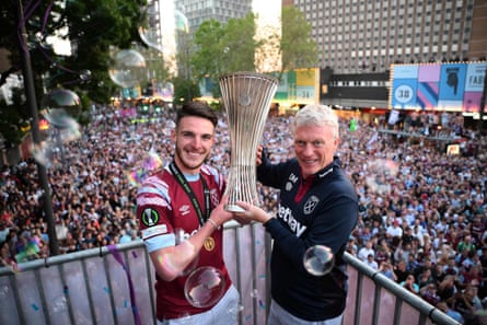 West Ham’s Declan Rice and David Moyes hold the Conference League trophy on stage at the Town Hall in Stratford, east London after an open-top bus parade