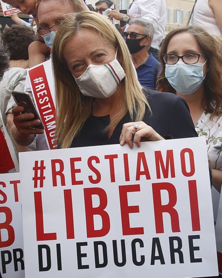 Giorgia Meloni wearing maks at a protest against Zan’s law in Rome on 16 July.