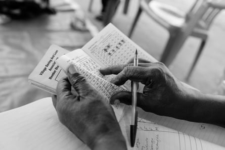 closeup of a pair of hands flipping through a booklet