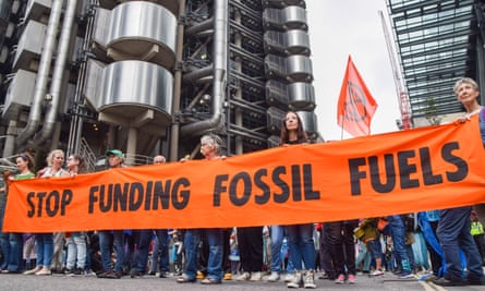 Protesters hold a ‘Stop Funding Fossil Fuels’ banner during the demonstration outside Lloyd’s of London last week.