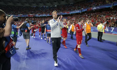 Jürgen Klopp and the Liverpool players applaud their fans after their defeat in Kyiv