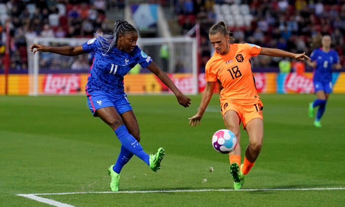 Kadidiatou Diani of France shoots on goal, pressured by Kerstin Casparij of the Netherlands