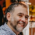 Headshot of Dining across the divider Joe