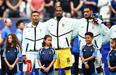 France’s Kylian Mbappe, Mike Maignan and Maxence Lacroix during the national anthems.