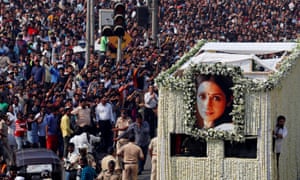 Fans watch as the funeral cortege of the late Bollywood actor Sridevi passes through Mumbai.