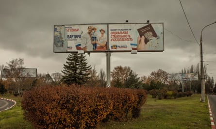 Two Russian billboards in Kherson city. The one on the right reads: “The passport of the citizen of Russian Federation means social stability and safety! Kherson region we are together with Russia.”