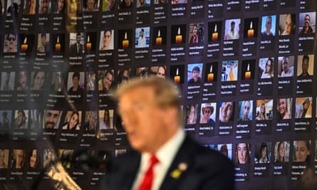 Man in front of collage at event
