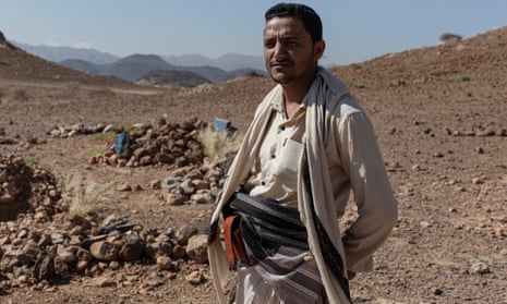 Trafficker Ahmad Dabisi in a makeshift migrant cemetery just outside Ataq, Shabwa Province, Yemen.