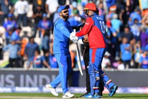 India’s captain Virat Kohli (left) shakes hands with Afghanistan’s Mujeeb Ur Rahman after victory.