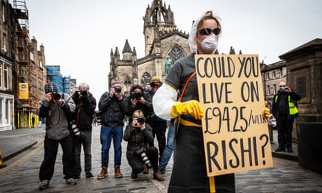 A young self-employed woman protests against the level of statutory sick pay available to self-employed and contracted workers during the coronavirus outbreak. Edinburgh, Scotland on  23 March.
