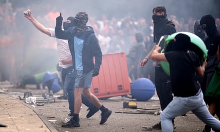 People riot outside the Holiday Inn Express in Manvers, near Rotherham, which was being used to house asylum seekers