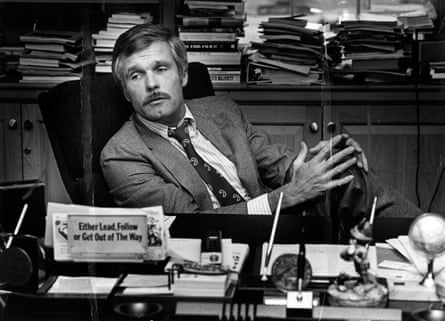a man sits at a desk