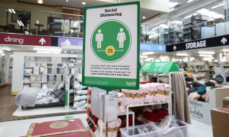 A social-distancing information sign is seen in a Dunelm store