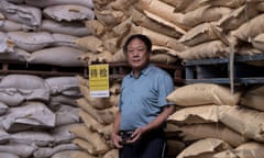 Chinese pig farmer Sun Dawu at a feed warehouse in Hebei.