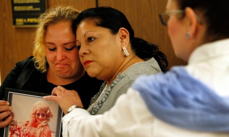 Pearl Nelson, left, in 2015 holds a photo of her mother Audrey, who was killed by Samuel Little. To her right is Mary Louise Frias, whose godmother was one of Little’s victims.