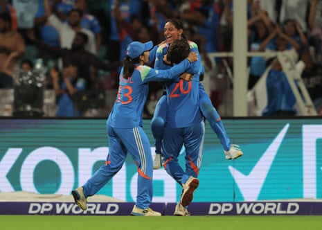 Harmanpreet Kaur of India celebrates with team mates Arundhati Reddy (obscured) and Harleen Deol after taking the catch to dismiss Nadine De Klerk of South Africa and lead her team to victory.