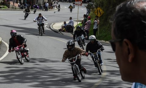 Participants descend a hill in the gravity bike competition in Medellin, Colombia.