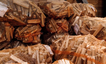 Sacks of firewood are stacked at a business in Berlin, Germany.